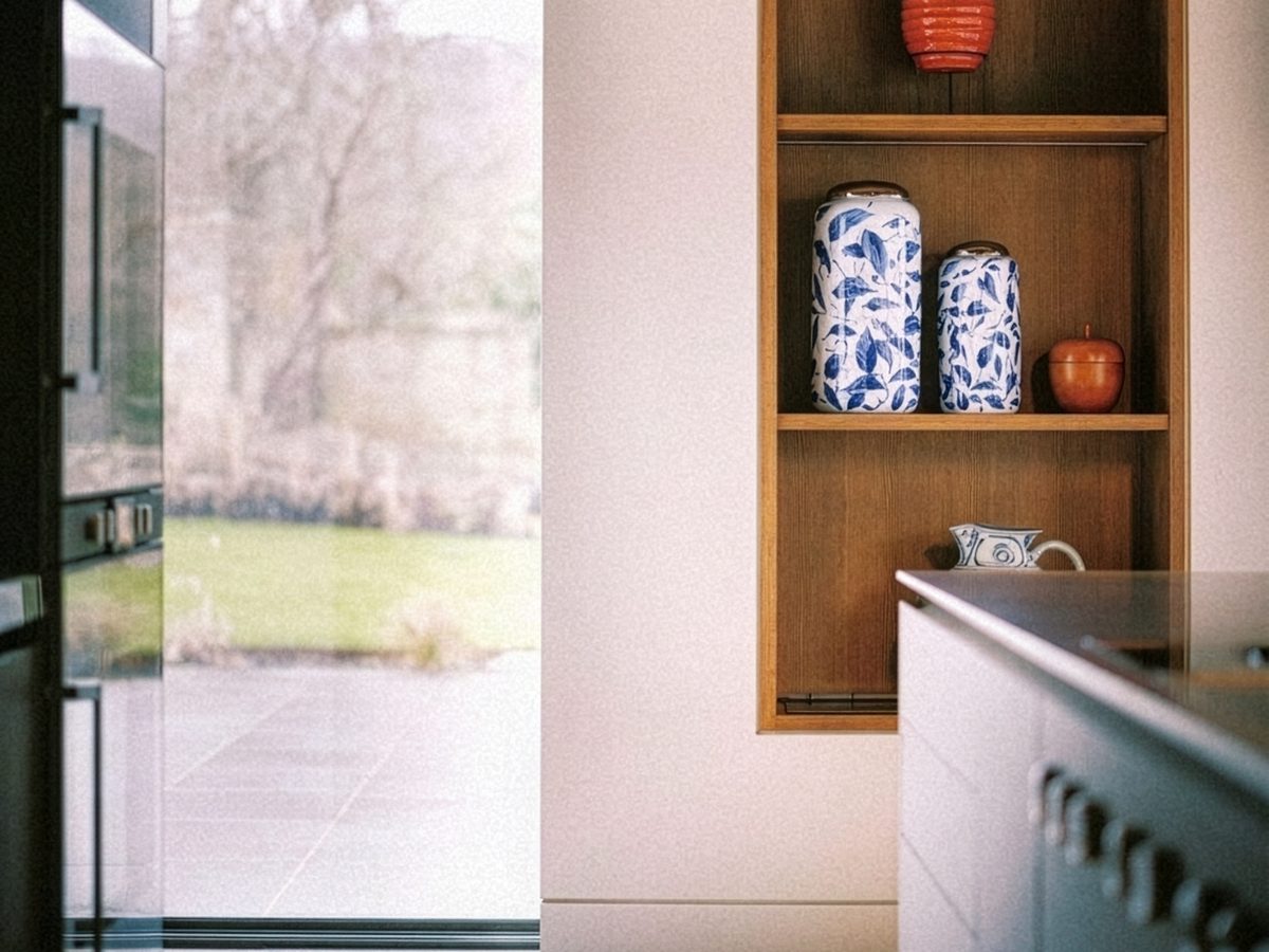 Contemporary kitchen with oak display niche and ceramics, interior design project by Seonaid Johnston